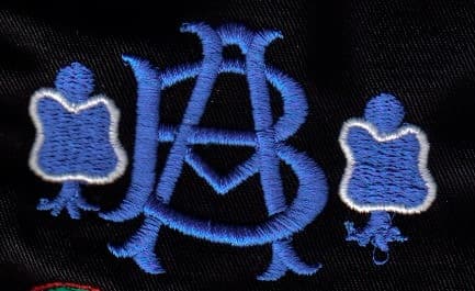Embroidered company branding on polo shirt